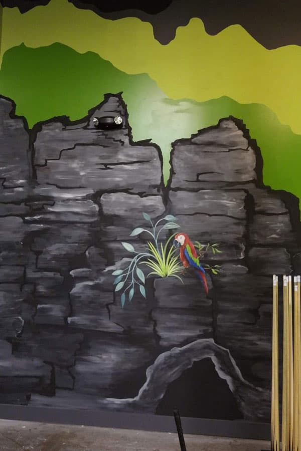 Amanda Bouldin's Parade Creations - Tropical background with parrot - Background scenery design. Painting including blacklight, texture, and airbrushing.