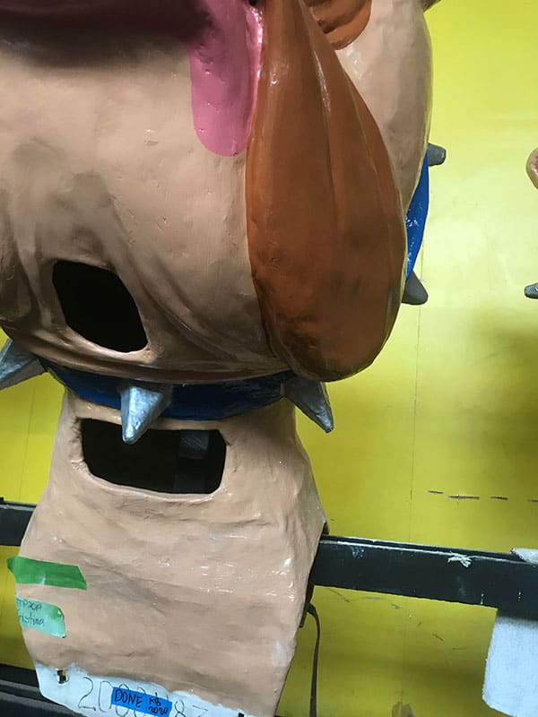 Amanda Bouldin's Parade Creations and Restorations - Damaged Bulldog - Restoration work on paper mâché. Painting, color matching, texture and airbrushing.