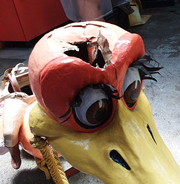 Amanda Bouldin's Parade Creations and Restorations - Damaged Riding Bird - Restoration work on paper mâché riding ostrich. Painting, color matching, texture and airbrushing.