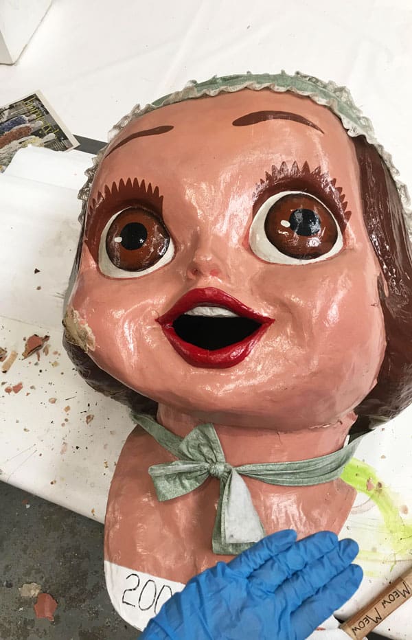 Amanda Bouldin's Parade Creations and Restorations - Cupie being restored - Restoration work on paper mâché. Painting, color matching, texture and airbrushing.