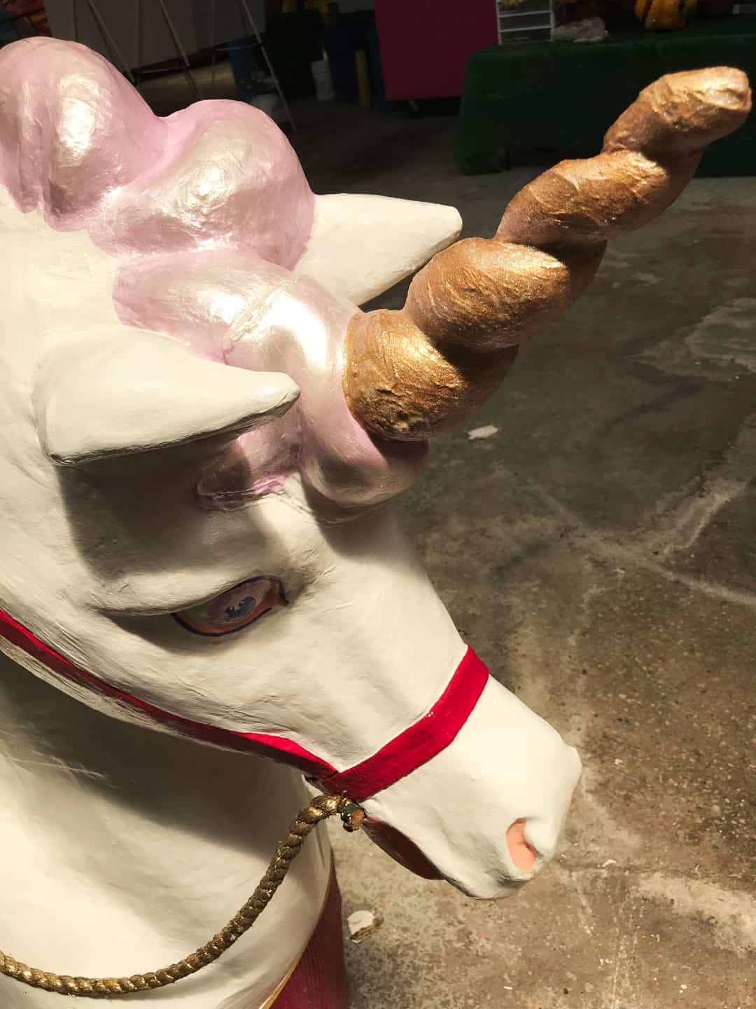 Amanda Bouldin's Parade Creations and Restorations - Unicorn - Restoration work on paper mâché. Painting, color matching, texture and airbrushing of riding unicorn.