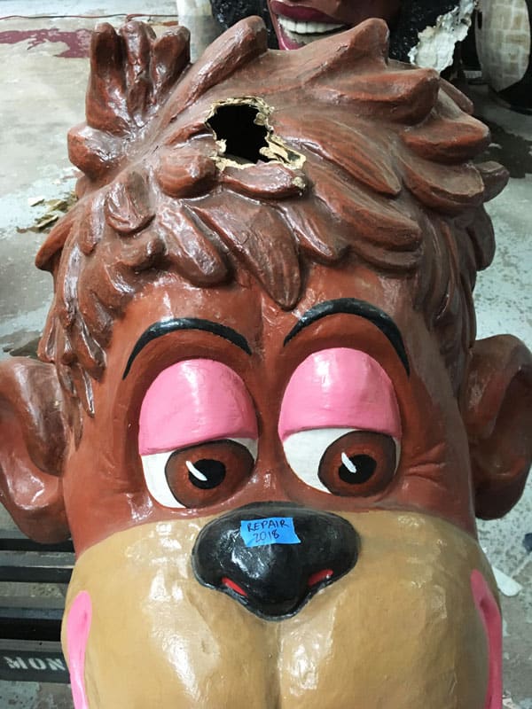Amanda Bouldin's Parade Creations and Restorations - Damaged Monkey - Pre-restoration work on paper mâché. Painting, color matching, texture and airbrushing.