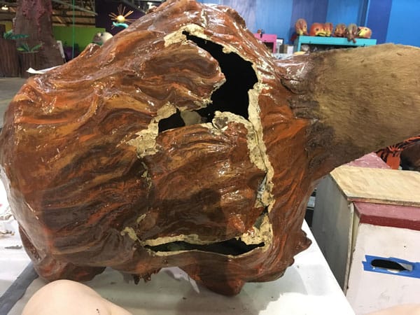 Amanda Bouldin's Parade Creations and Restorations - Damaged Monkey - Pre-restoration work on paper mâché. Painting, color matching, texture and airbrushing.